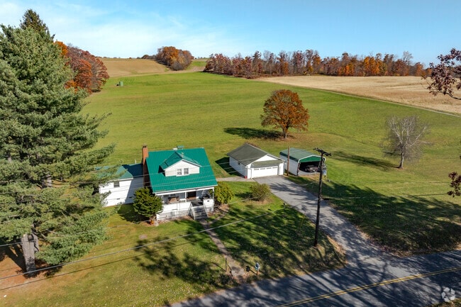 A small farm house  on Main Street in Susquehanna with big property.