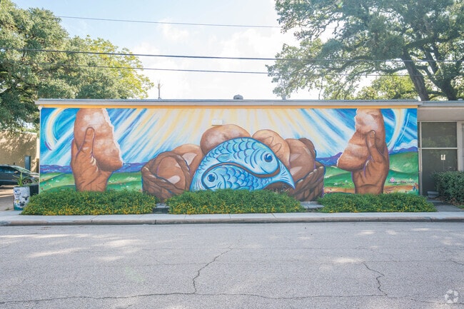 Colorful murals decorate downtown Manvel, showcasing local artistic pride.