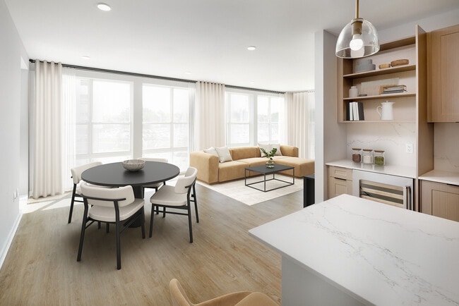 Signature Collection Dining and living areas with hard-surface vinyl plank flooring