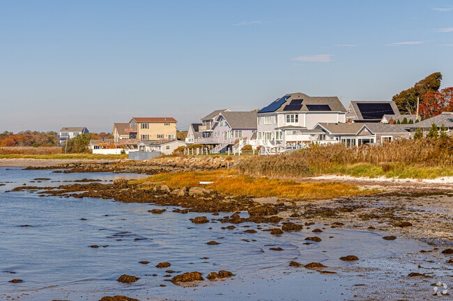 Pope Beach houses line the rugged shoreline near Fairhaven’s scenic bay.