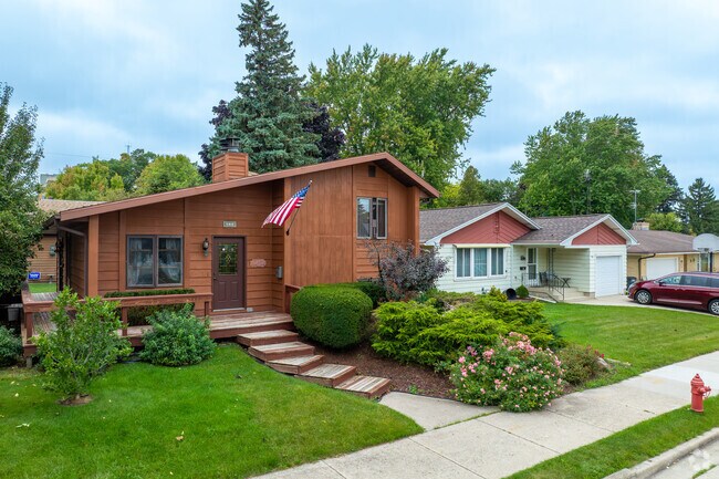 Craftsman bungalow in Wildwood features a deep porch and gabled roof.
