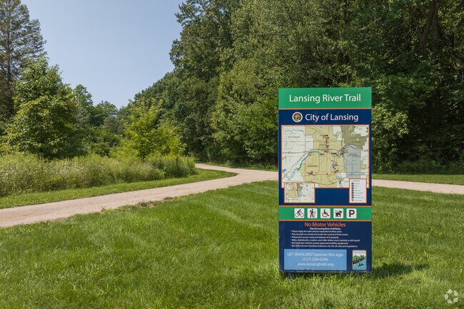 A section of the Lansing River Trail winding through Benjamin Davis Park near Wexford Heights.