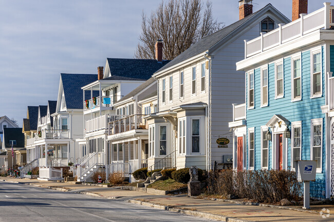 A row of Colonial Revival and New Englander styled homes in Central Gloucester, MA.