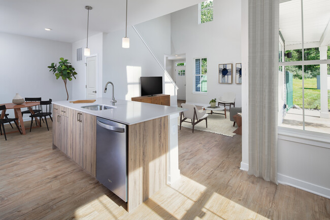 Upgrade Scheme townhome kitchen, dining, and living areas with hard surface flooring