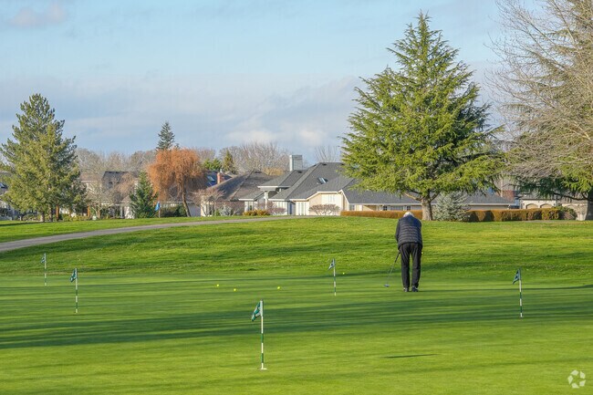 Locals enjoy the Claremont Golf Course putting green.
