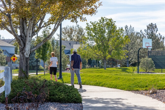 The Farm-Arapahoe has leafy green trees and walkable sidewalks.