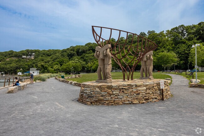 This sculpture of Port Jeffersons ship builders sits at Harborfront Park.