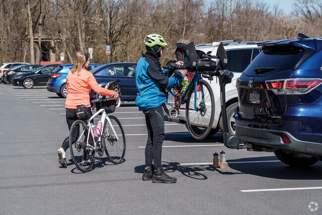 Two friends get ready for a ride at the Wilson Bike Path that wings through Easton.