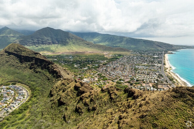 Maili homes are nestled between lush mountains and crystal seas.