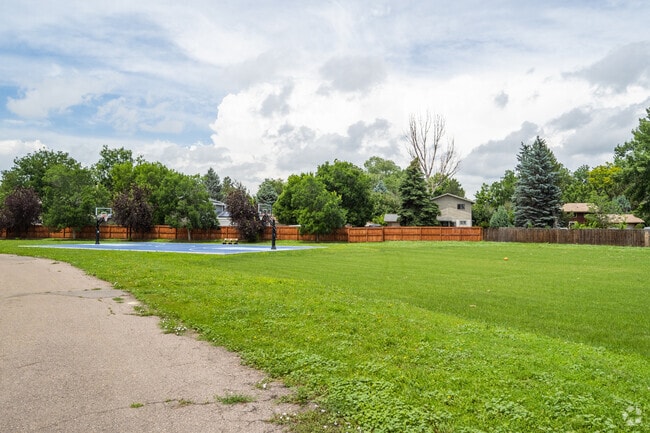 The basketball court and open green space at Justice High Charter School in Lafayette, Colorado