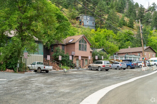 Row of Eldorado Springs homes, each a cozy retreat with breathtaking views and serene vibes.