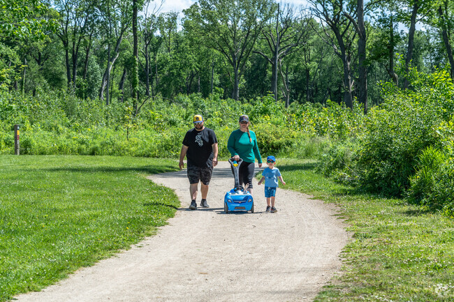 A family goes for a stroll in Captain Daniel Wright Woods near Mettawa.