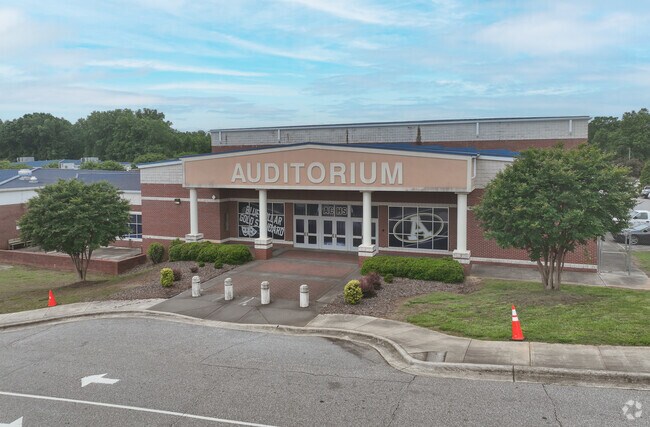 Large white columns welcome you to the Auditorium at Alexander Central High School.