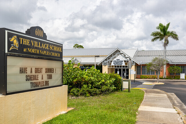 The Village School in Naples welcomes students with a large sign and central entrance.