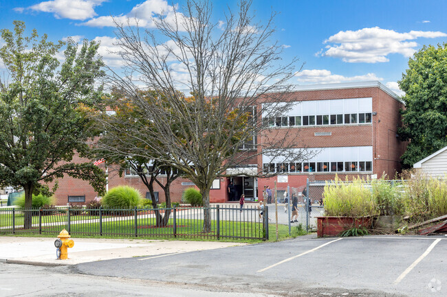 Student having recess in the school yard at Robert Morris School.
