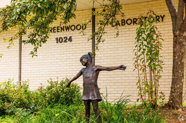A statue outside Greenwood Laboratory School highlights the spirit of the school.