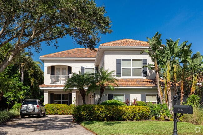 Homes in Bridgewater Bay offer large shading trees and meticulously maintained yards.