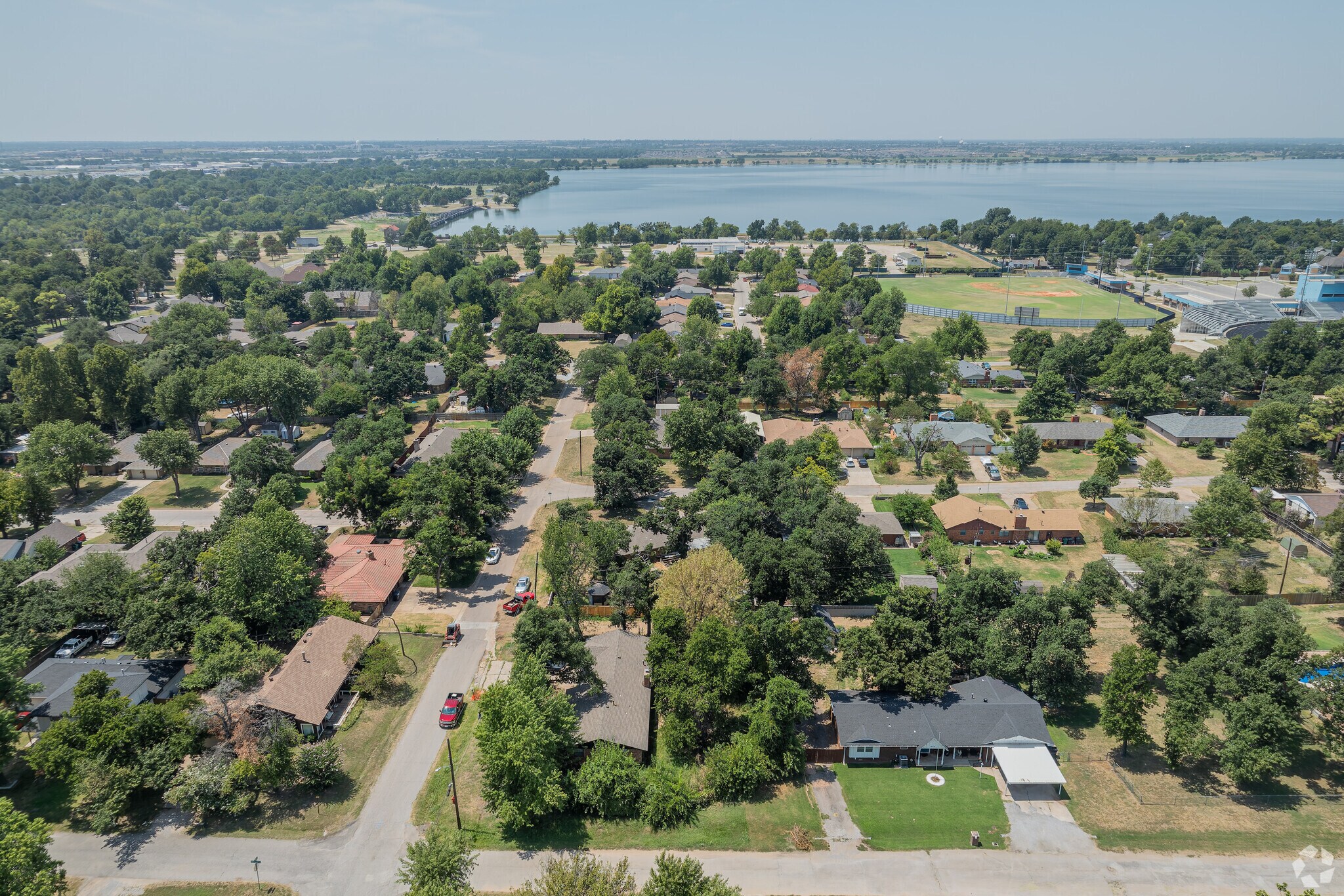 Residents of Sycamore Creek enjoy large homes surrounded by dense old growth trees.