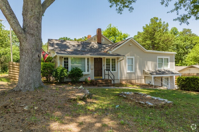 Shaded by sprawling trees, cozy cottages offer a laid-back lifestyle in Austin.