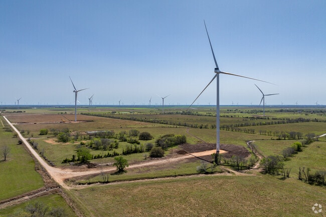 Wind farms are scattered around the edge of Bay City, bringing innovation.