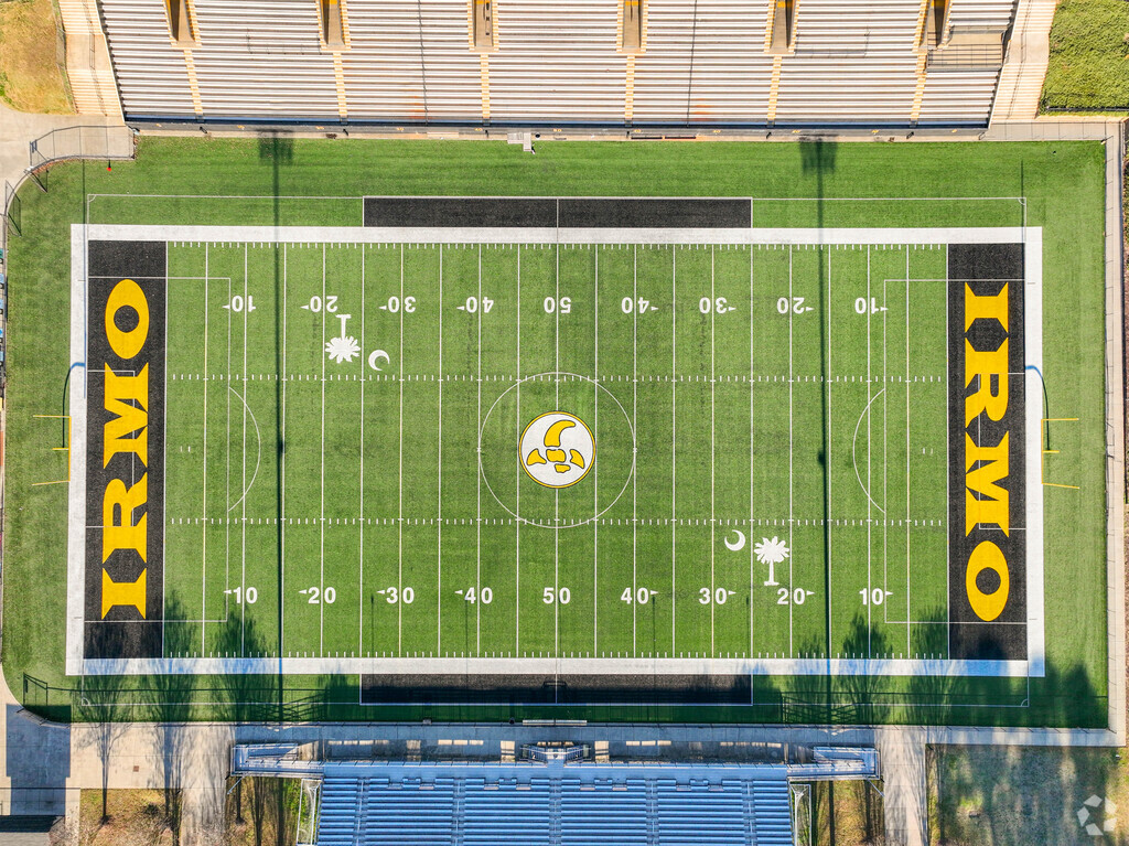Football players enjoy a well maintained turf field at Irmo High School.