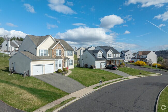 Modern Colonial homes dating from the early 2000s offer space for large families in North End.