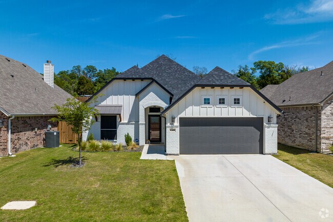 Contemporary traditional home with brick and wood exterior in Weatherford.