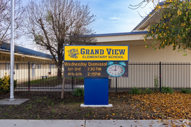 A large lighted marquee greets students at the entrance to Grand View Elementary School.
