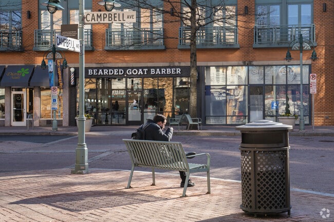 Residents can break for lunch on the bench along Campbell Ave in Douglas Park.