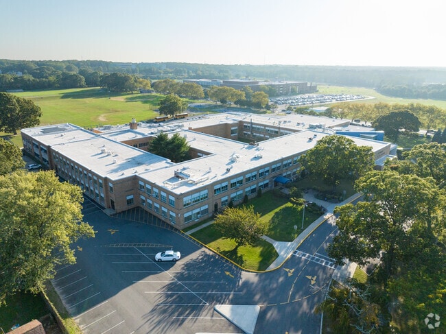 NID507906 Happague Middle School sits right next to Happague High School in a busy neighborhood.