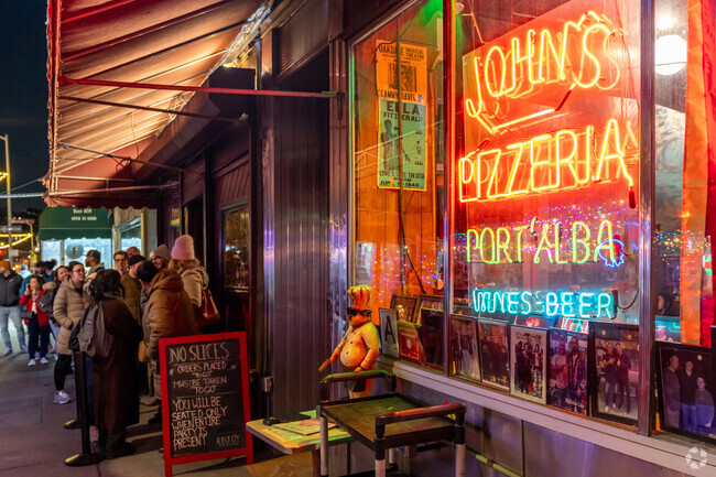 West Village locals gather at John's Pizzeria for arguably the best brick oven pizza.