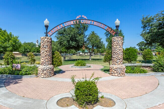 A stone arch welcomes visitors to Madera County Courthouse Park.