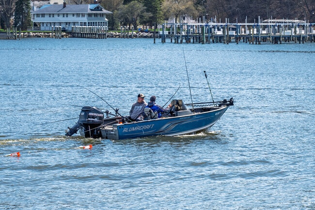 A couple of friends take their boat out on Lake Michigan via Lake Macatawa in Beechwood.