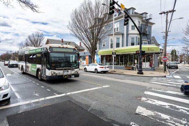 Witness the pulse of Providence as RIPTA buses navigate Broadway St. in Federal Hill.