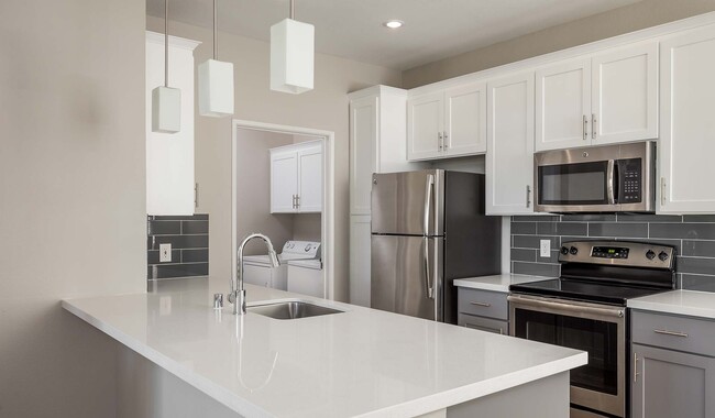 Kitchen features upgraded cabinets and quartz countertops