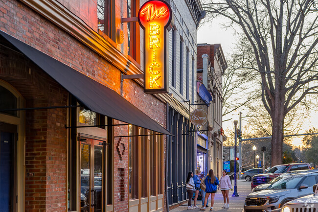 In the heart of downtown Milledgeville, college students come together to unwind and connect, filling the streets with laughter and energy.