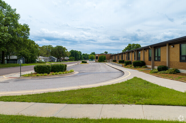 Sidewalks and green space warp around Vermillion Elementary School.