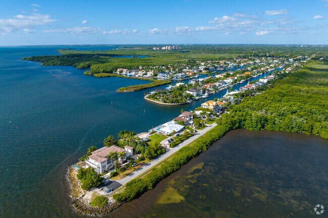 Waterfront homes occupy a scenic point in Gables By The Sea, Coral Gables.