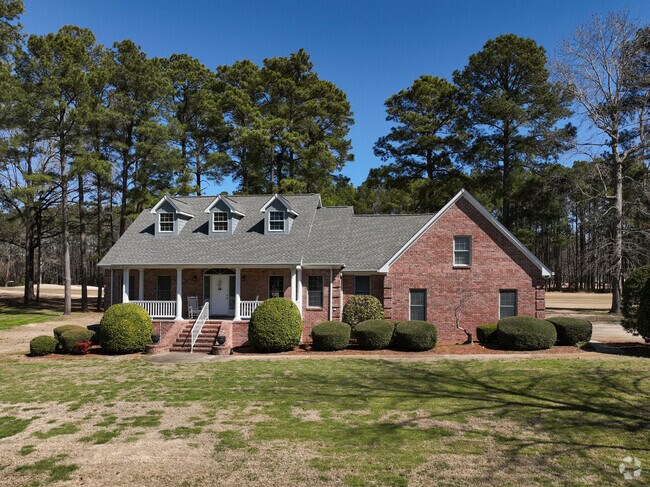 Cape Cod-inspired homes are a signature feature of Albemarle Plantation's coastal charm.