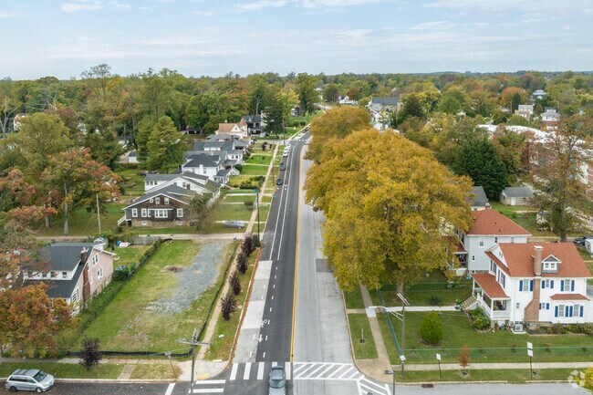Down residential streets in Howard Park, roofs and trees reach for the heavens.