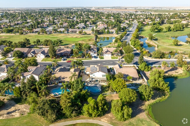 An aerial vista of Eagle Ranch showcasing homes and tranquil lakes.