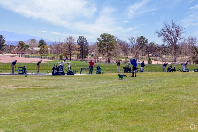 People line up at the driving range in Paradise East to release some steam.