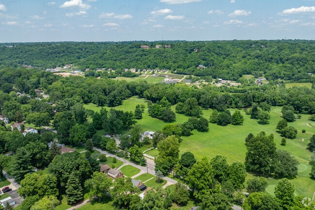 The neighborhood of Cotillion Village features residential areas surrounded by greenery.