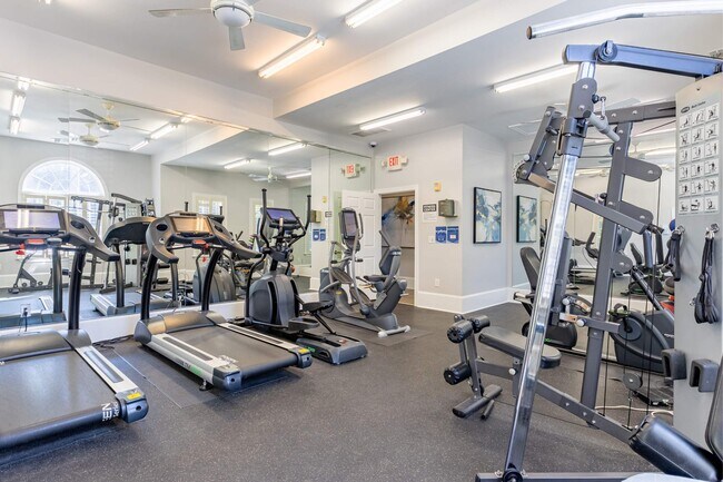 Large fitness center with ample lighting at Heron Lake