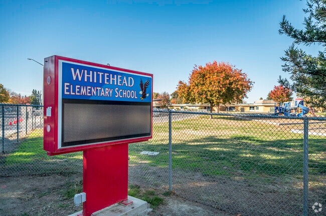 T.L. Whitehead Elementary School has a digital information sign at the front corner.