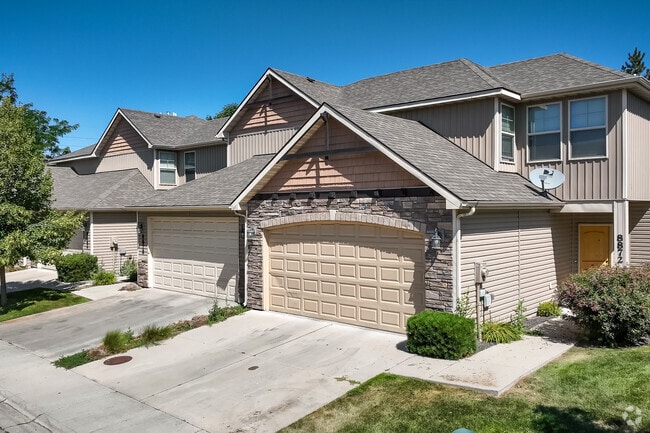 Double-level duplexes with two-car garages in Maple Grove-Franklin near West Boise.