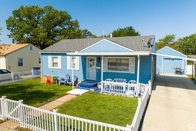 This Matlock Heights’s home is surrounded by a white picket fence.