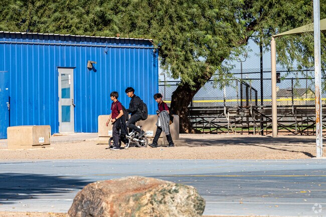 Locals enjoy the basketball courts and other amenities at Joe Orduno Park in San Luis, Arizona.