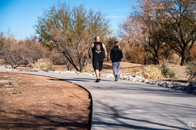 Casual walkers strolling along a trail in Whitney Henderson, NV.