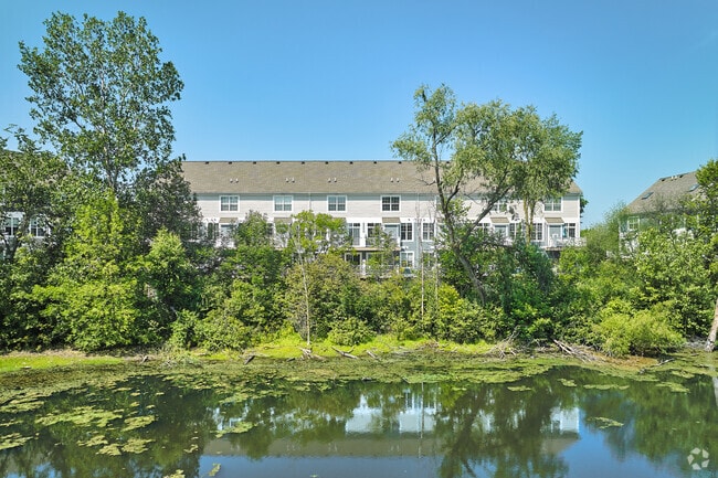 These South Maple Park townhomes come with a stunning pond view right from your balcony.